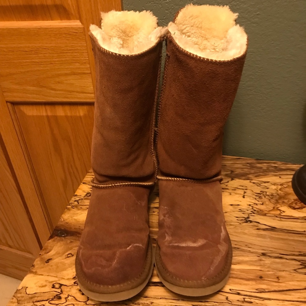 Ugg Boots with bows up the back.